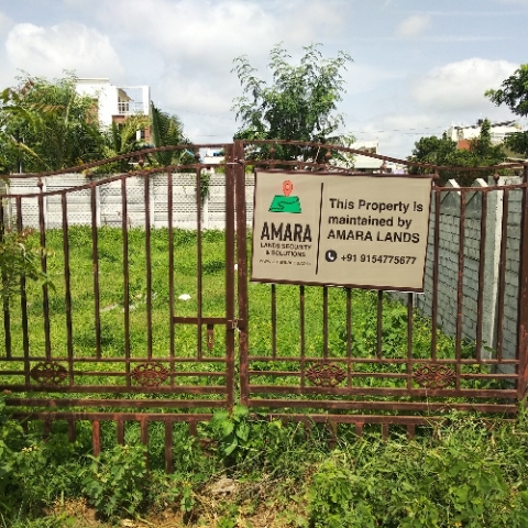 Amara Lands board mounted on the gate of a client plot in a residential area of Hyderabad